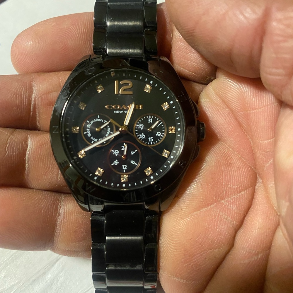 Coach Watch. Black and gold tones